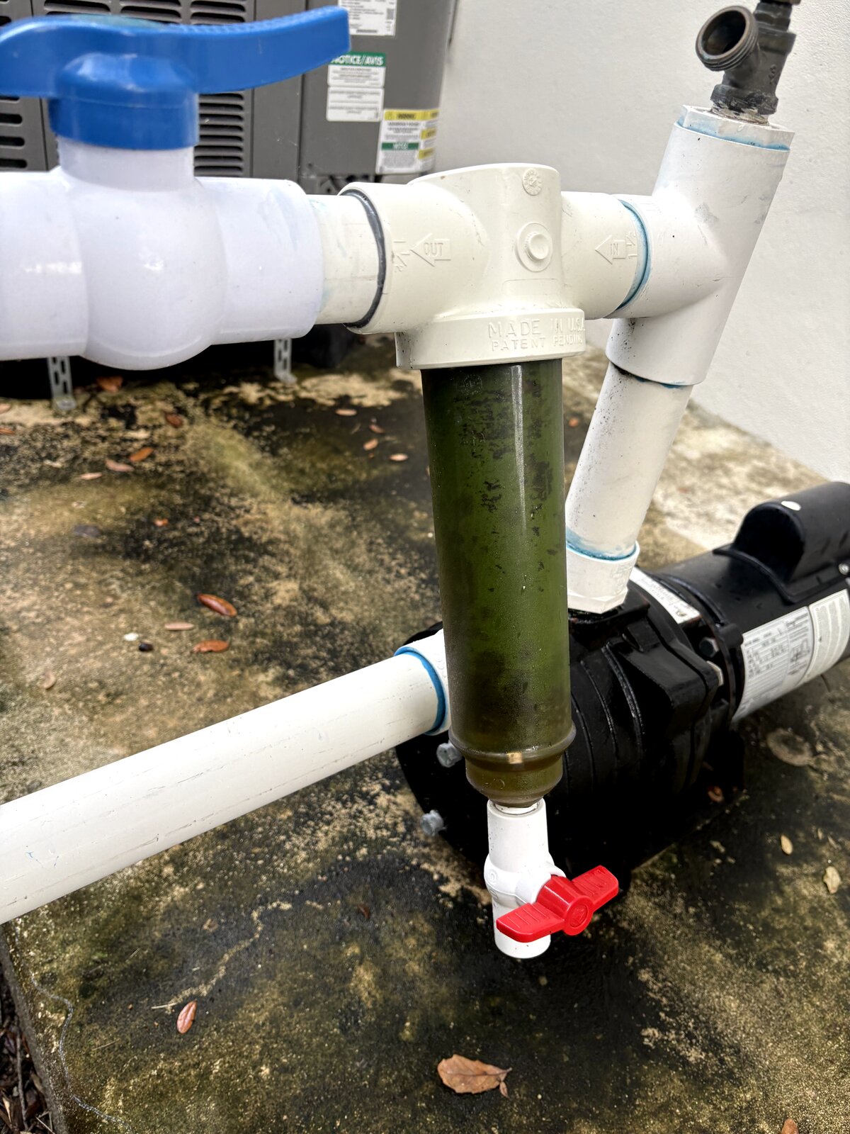 irrigation pump filter clogged with algae and sediment removed from a Miami well system