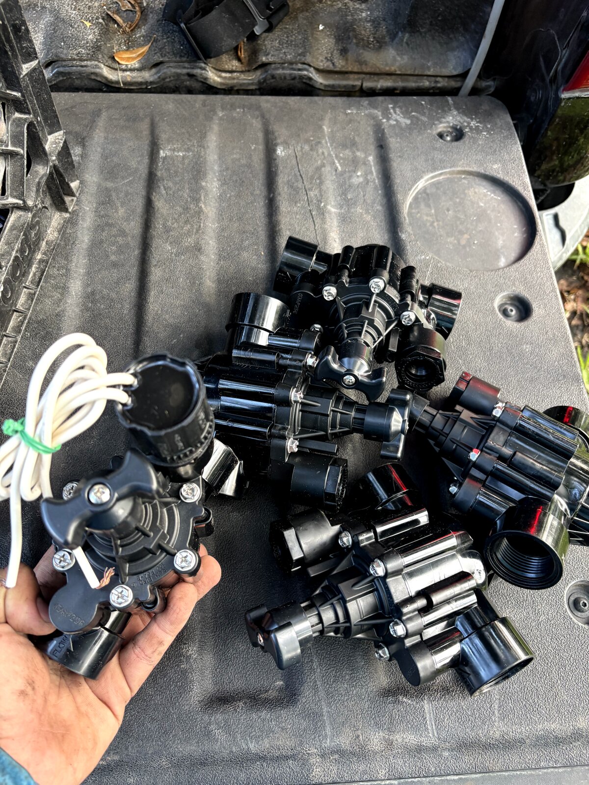 Rain Bird-compatible solenoid valves and parts ready for Miami irrigation install