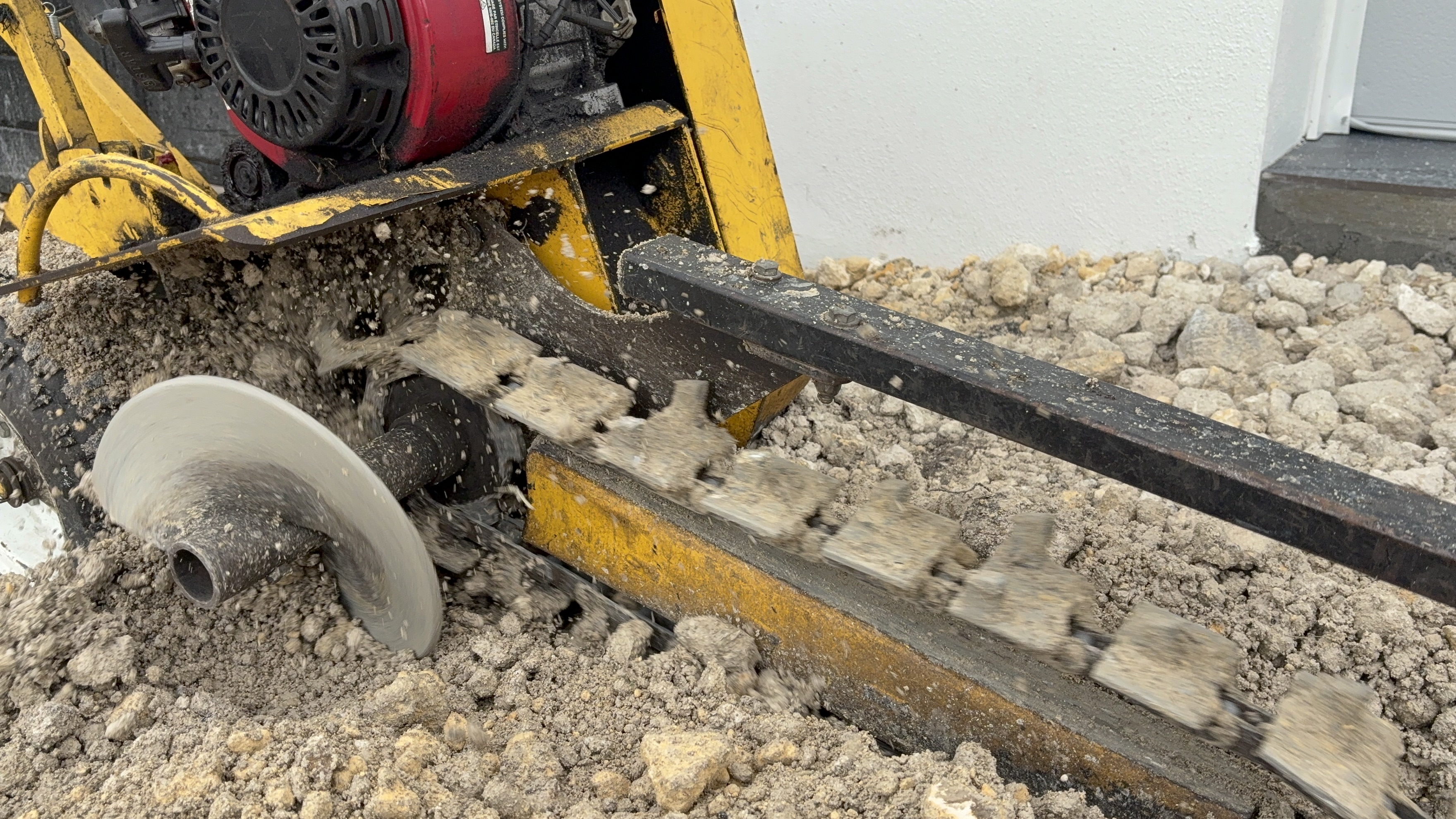 freshly trenched and repaired irrigation line backfilled and ready in Miami yard