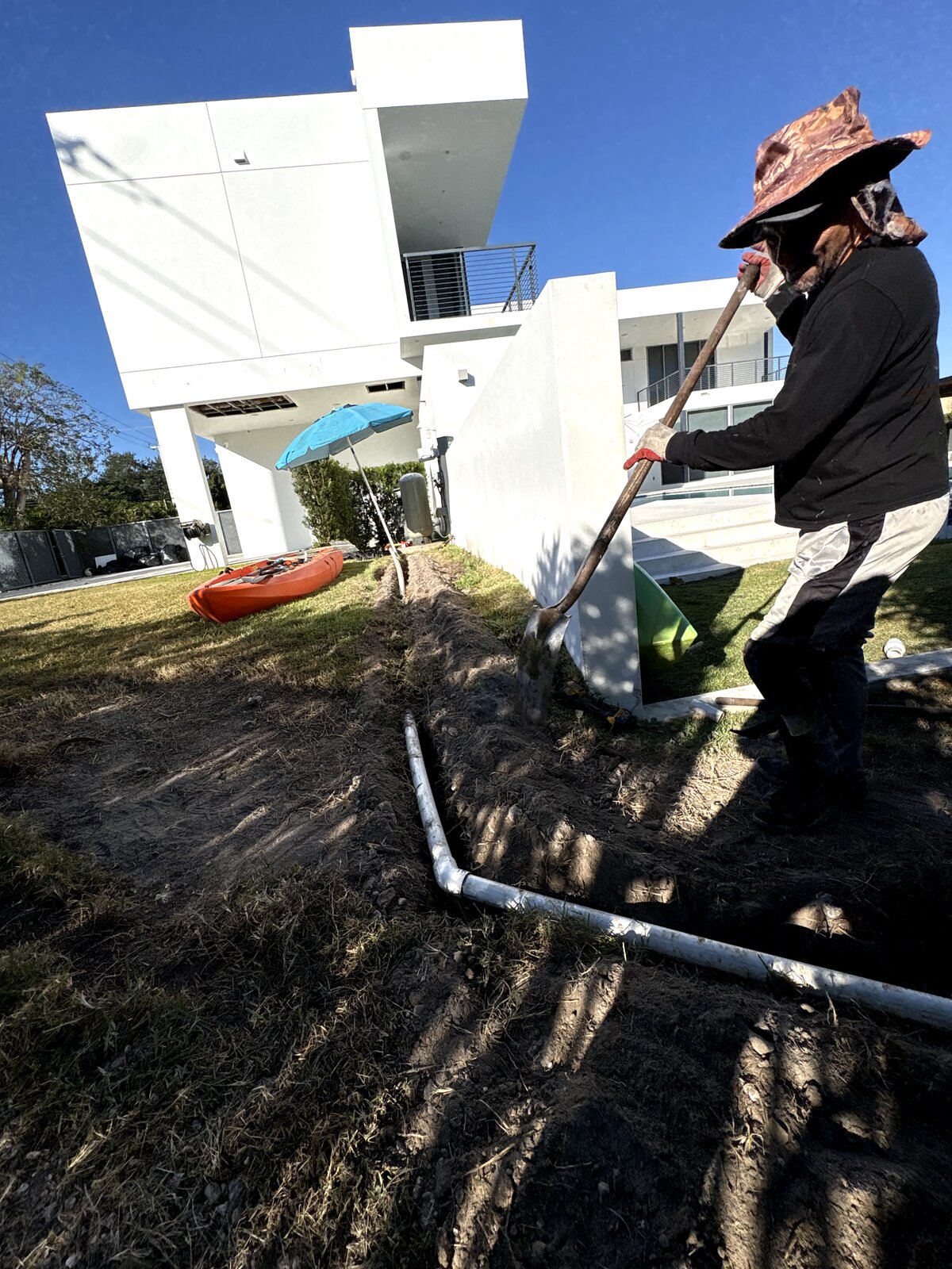 Freedom Flow Irrigation technician repairing sprinkler system in Miami-Dade